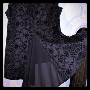 Black brocade sleeveless split back blouse.